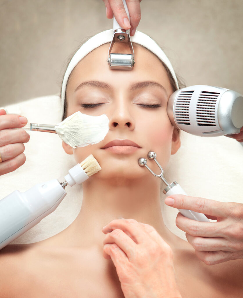 woman getting facial with multiple modalities